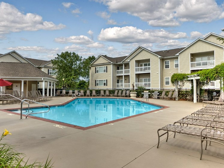 Take a dip in our resort-style swimming pool at Abberly Woods Apartment Homes by HHHunt, Charlotte